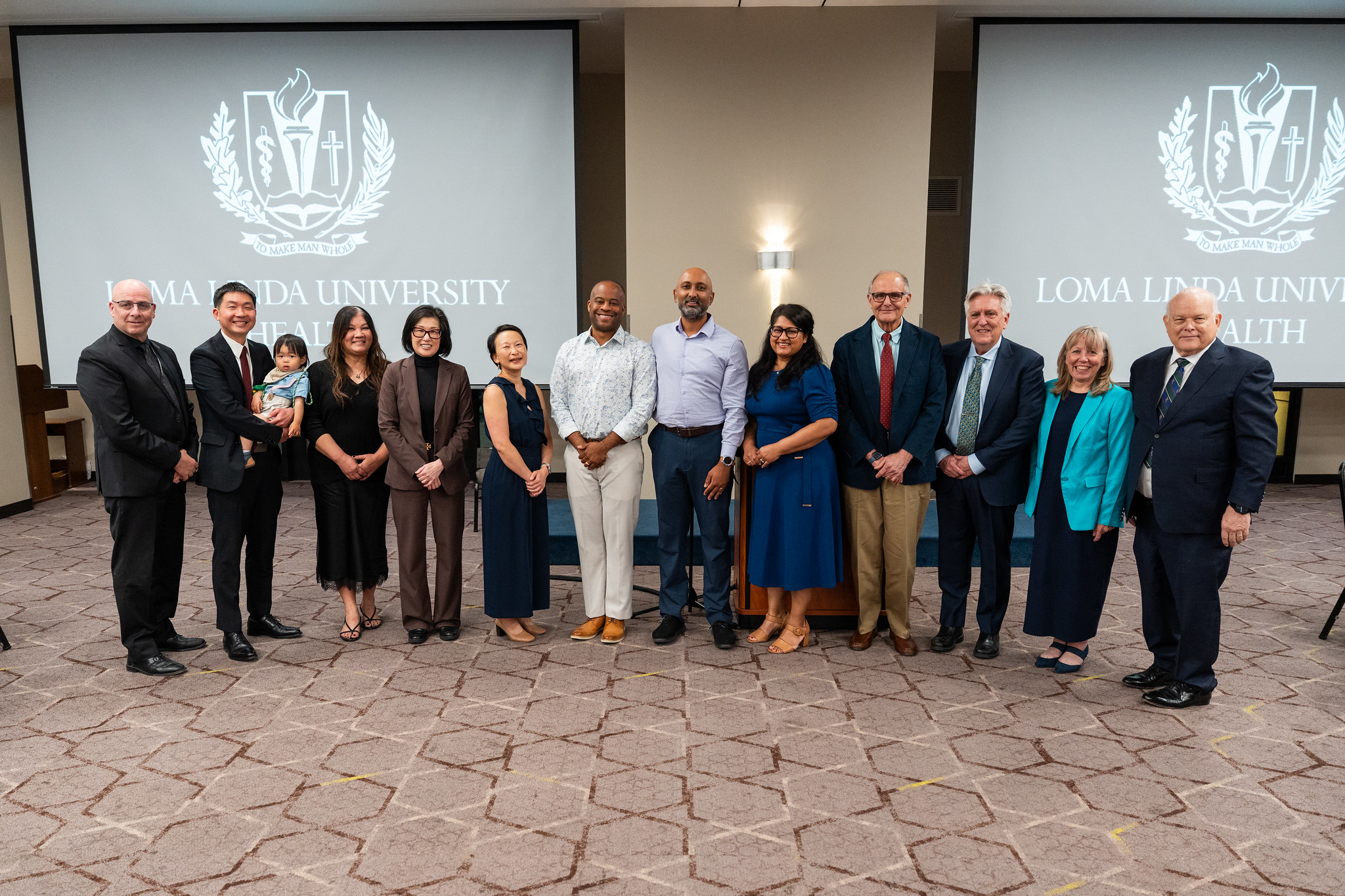 Photo of group of faculty physicians and alumni for 2026 AOA Banquet