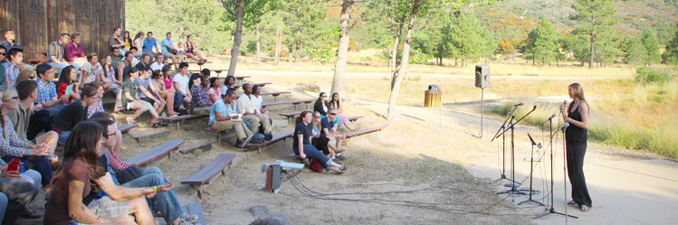 students gather outside for a worship service