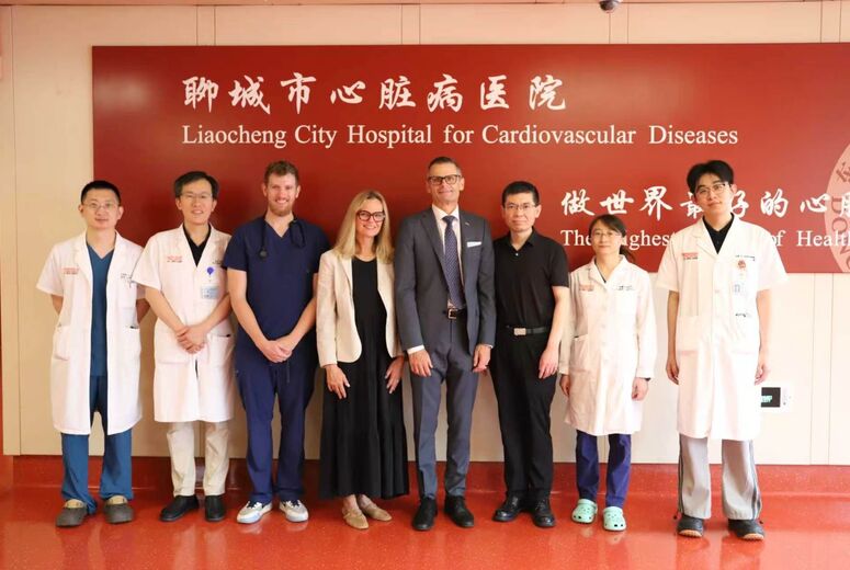 loma linda university health leadership and medical student with physicians looking at camera inside a hospital
