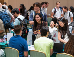 students at mixer learning about organizations
