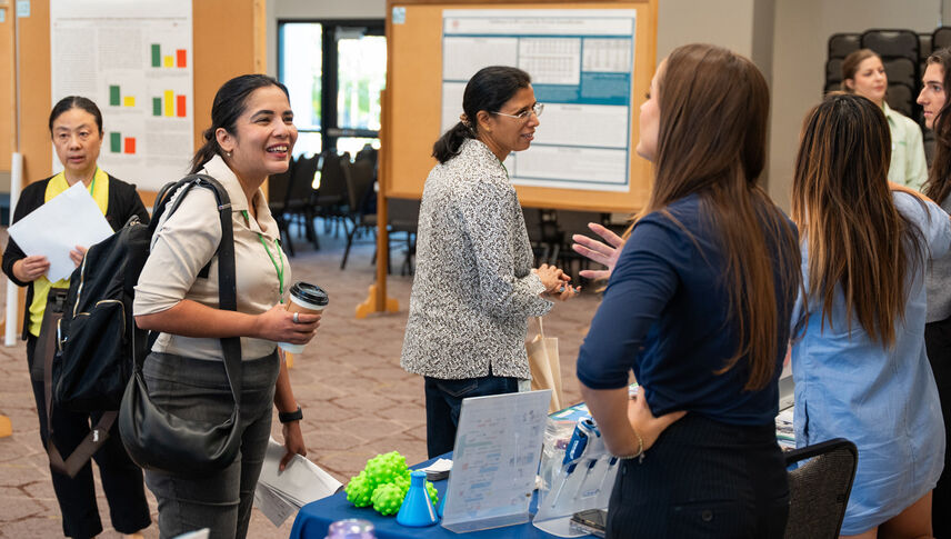 group of women talking with each other in room