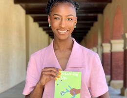 Medical student holding new book